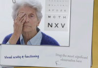 An elderly woman covers one eye with her hand. An eye chart is next to her.